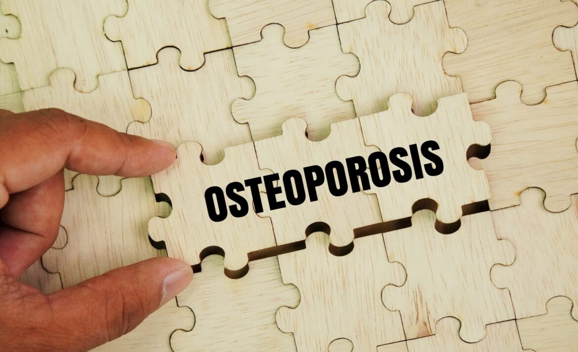 Wooden puzzle with words Osteoporosis is a type of bone disease characterized by reduced bone mineral density