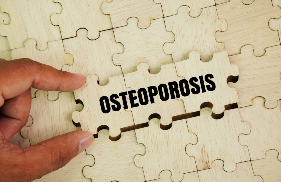 Wooden puzzle with words Osteoporosis is a type of bone disease characterized by reduced bone mineral density
